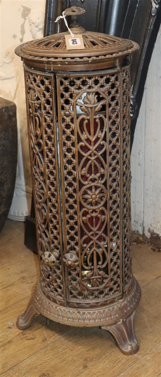 A cast iron conservatory heater with pierced side H.79cm